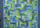 Radiant Blue Harmony: A Geometric Quilt That Captures the Sky and Sea