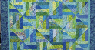 Radiant Blue Harmony: A Geometric Quilt That Captures the Sky and Sea
